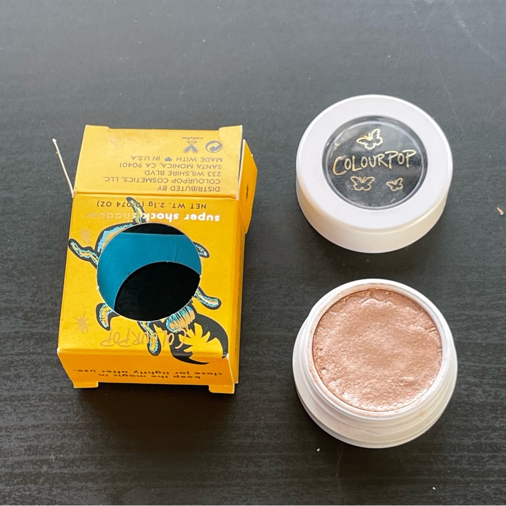 Colourpop Supershock Shadow in Force Behavior, a bright champagne gold shade